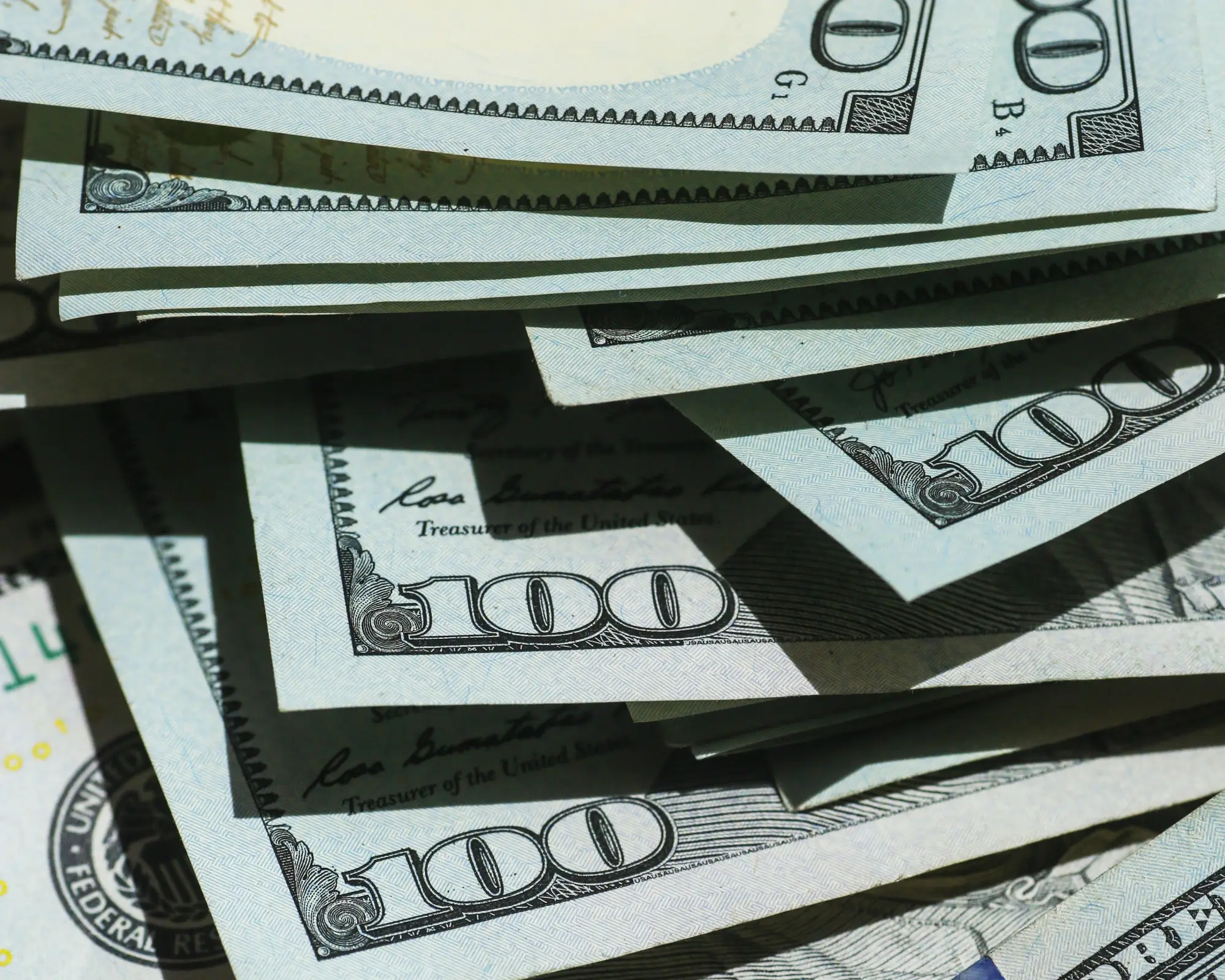 A pile of $100 bills
